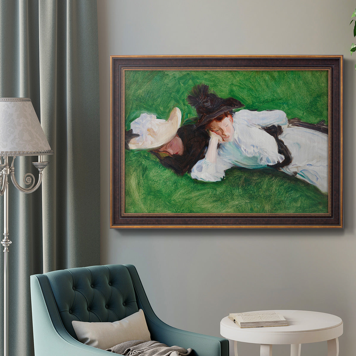 Impressionist outdoor portrait of two girls by John Singer Sargent in an ornate bronzed mahogany wood frame displayed in a bright interior setting.