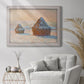 Impressionist winter haystack scene by Claude Monet in an ornate weathered white frame displayed in a bright interior setting.