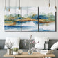 Three-panel canvas wall art featuring abstract blue watercolor landscape, displayed in a modern living room above seating.