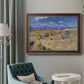 Impressionist wheat harvest scene by Vincent van Gogh in an ornate bronzed mahogany wood frame displayed in a bright interior setting.
