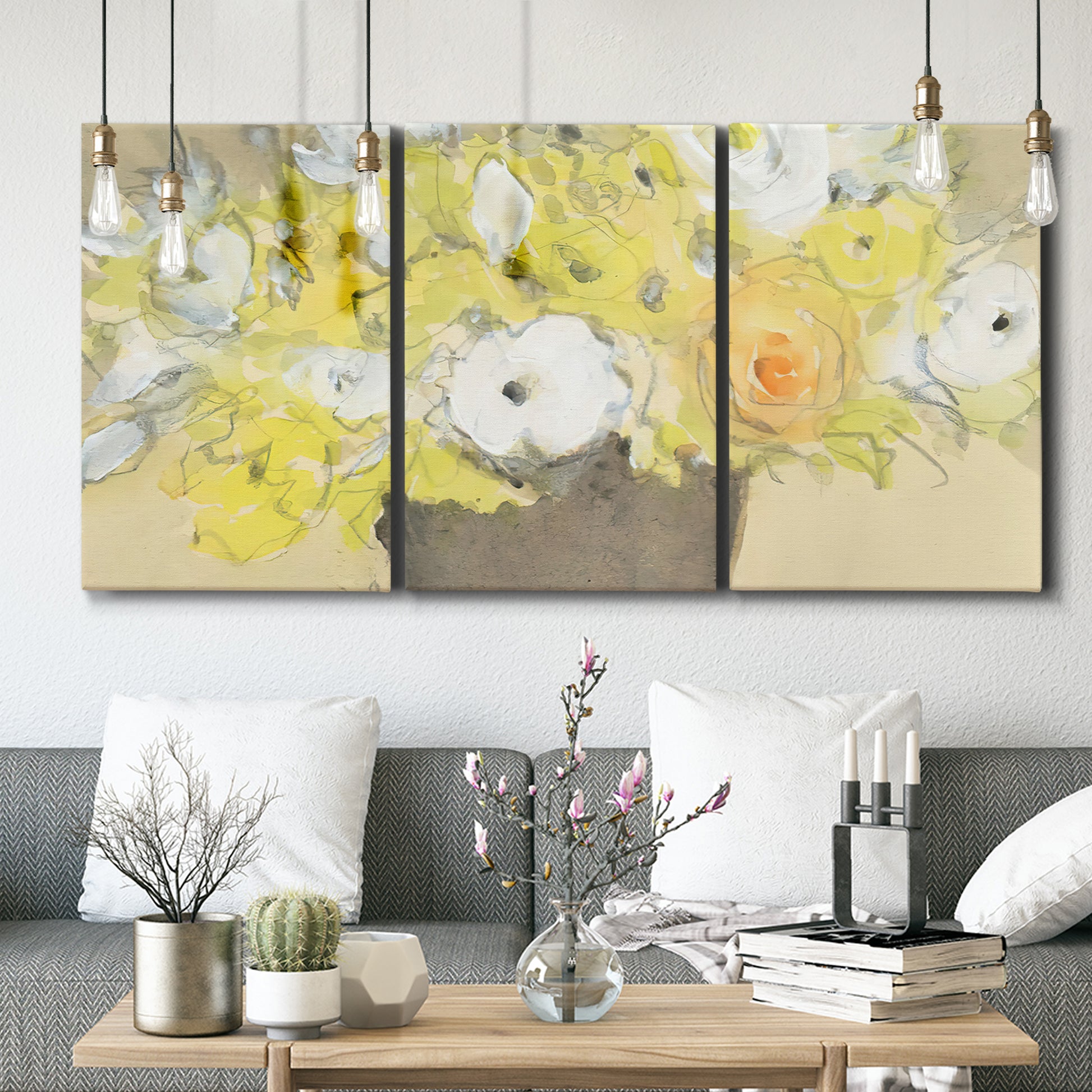 Three-panel canvas wall art featuring abstract floral table arrangement, displayed in a modern living room above seating.