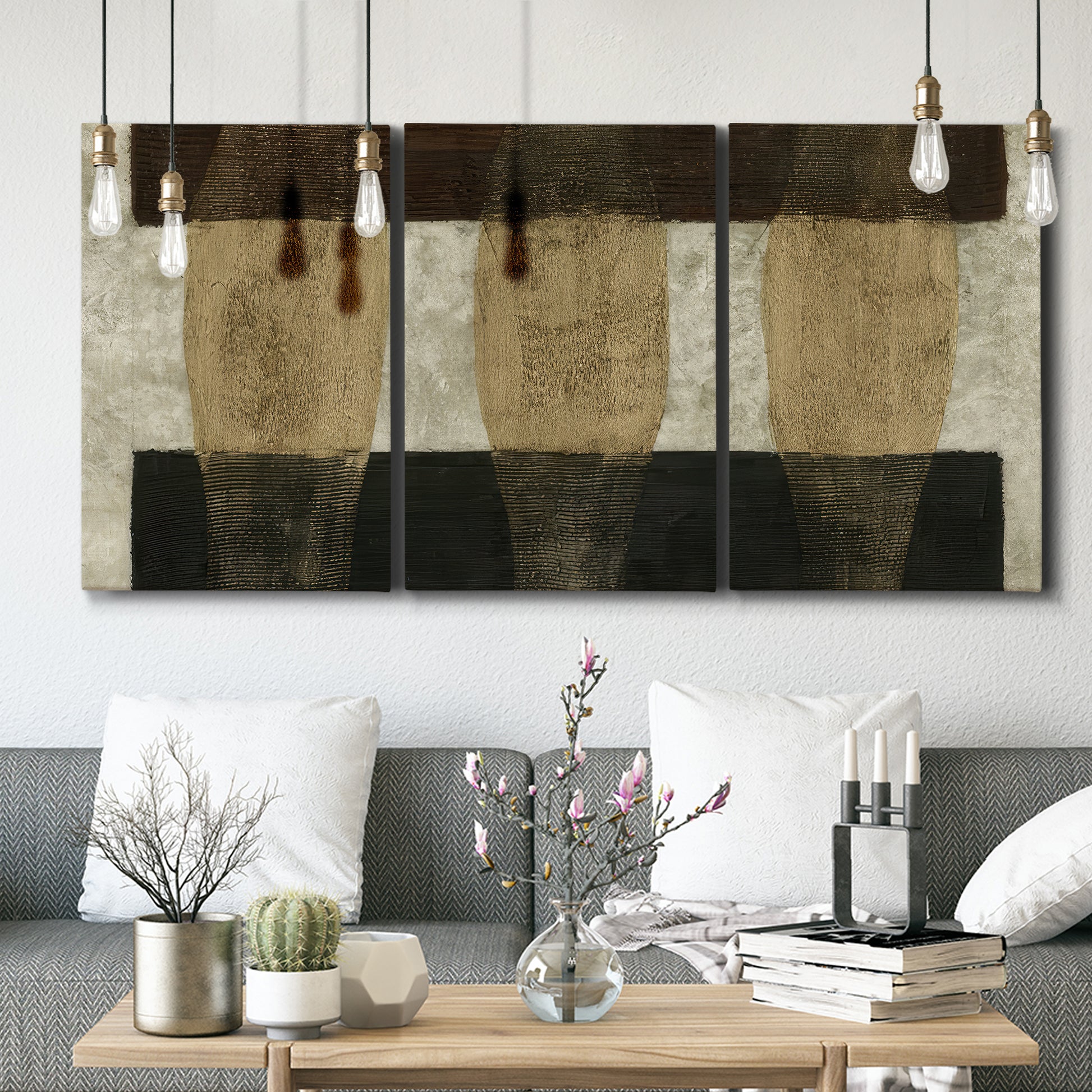 Three-panel canvas wall art featuring textured abstract vessel forms, displayed in a modern living room above seating.