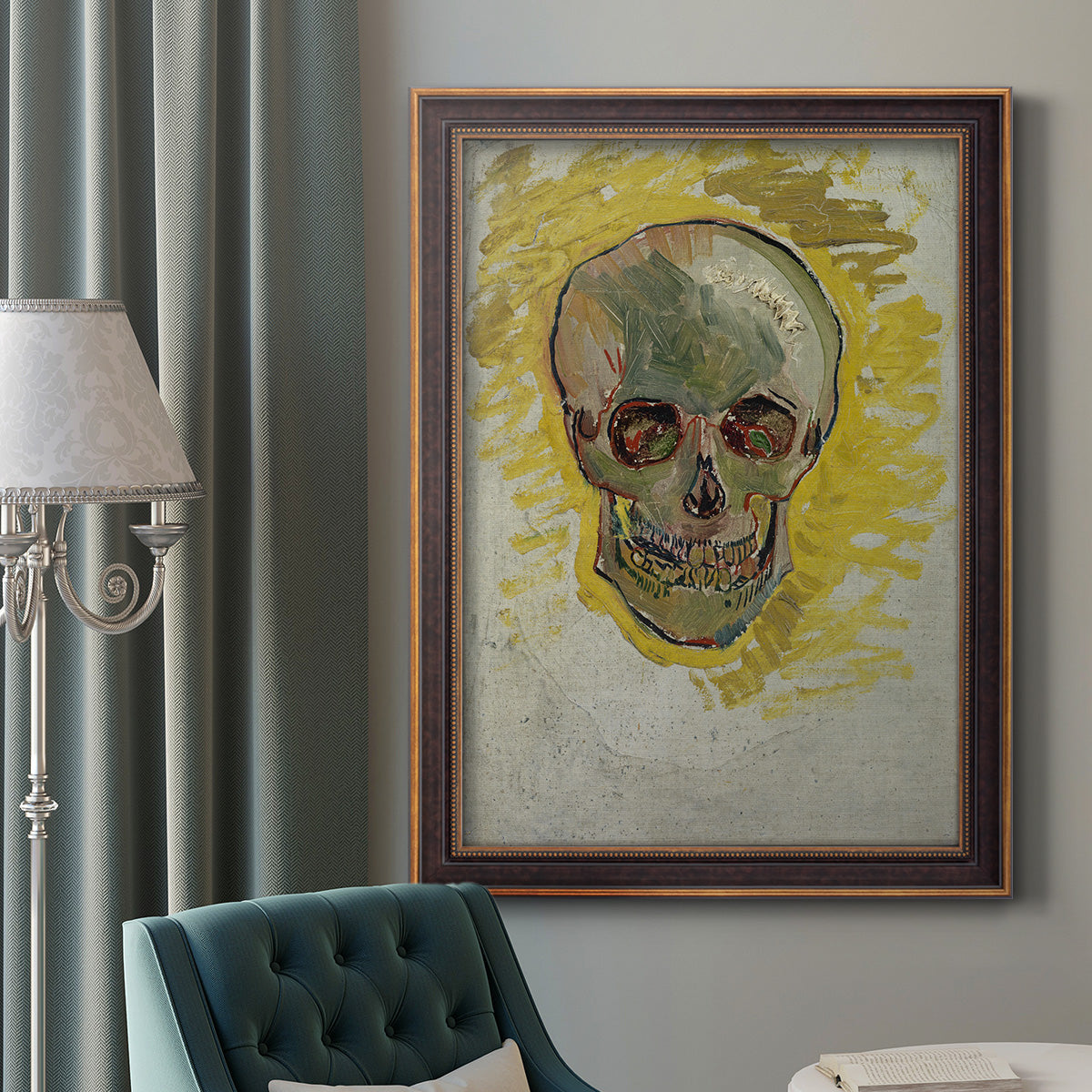 Expressive skull study painting by Vincent van Gogh in an ornate bronzed mahogany wood frame displayed in a dark-toned interior setting.