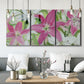 Three-panel canvas wall art featuring pink and white lilies in bloom, displayed in a modern living room above seating.