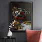 Impressionist floral still life painting by Claude Monet in an ornate black frame with gilded inner detail displayed in a dark-toned interior setting.