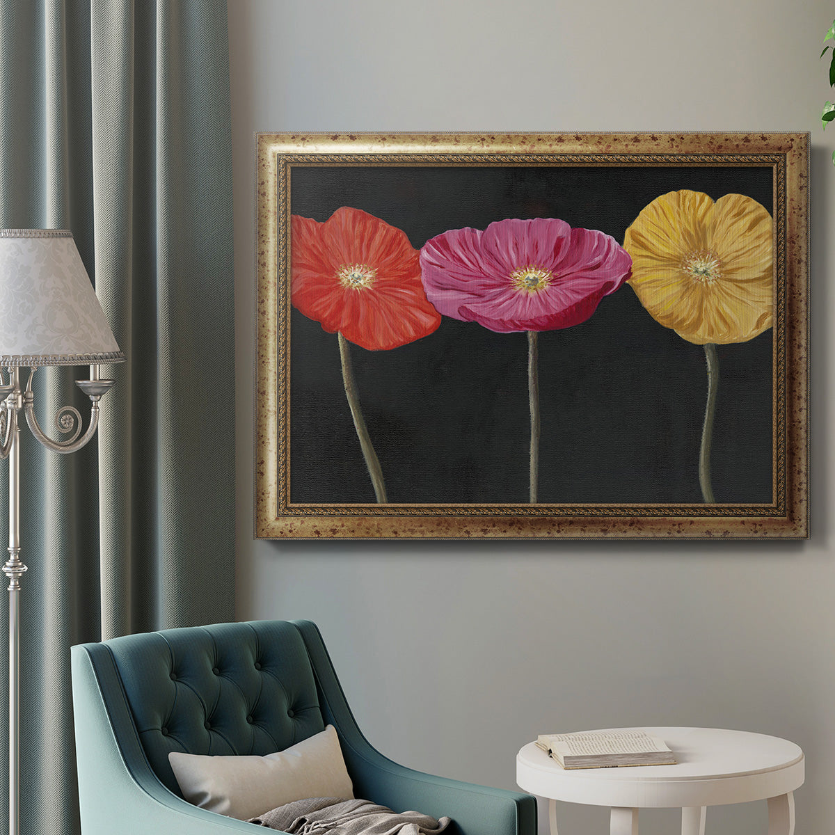 Contemporary poppy flower artwork in an ornate vintage gold frame displayed in a neutral interior setting.
