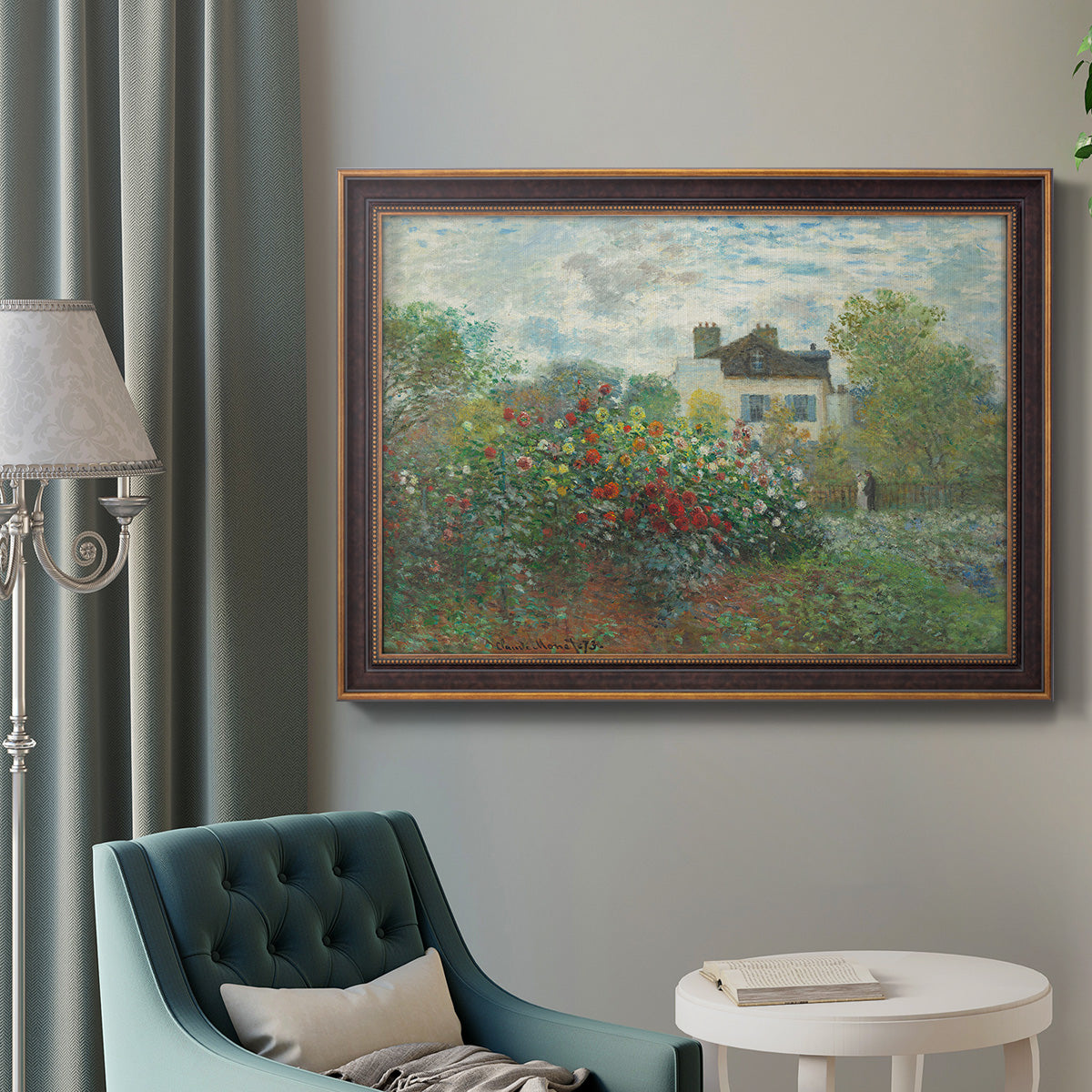 Impressionist garden landscape at Argenteuil by Claude Monet in an ornate bronzed mahogany wood frame displayed in a bright interior setting.
