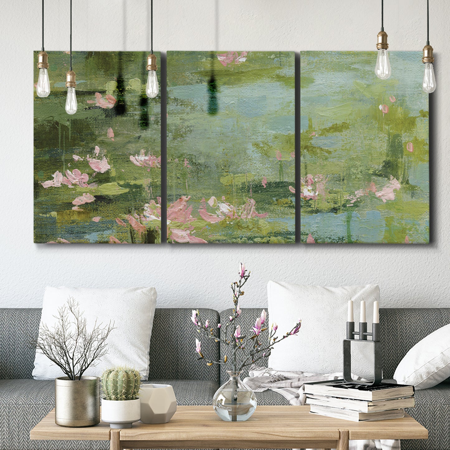 Three-panel canvas wall art featuring muted water lily pond, displayed in a modern living room above seating.