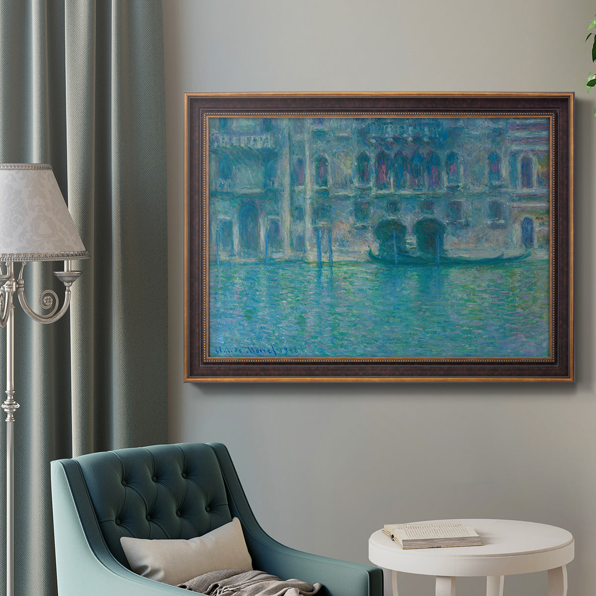 Impressionist Venetian palace waterfront scene by Claude Monet in an ornate bronzed mahogany wood frame displayed in a bright interior setting.
