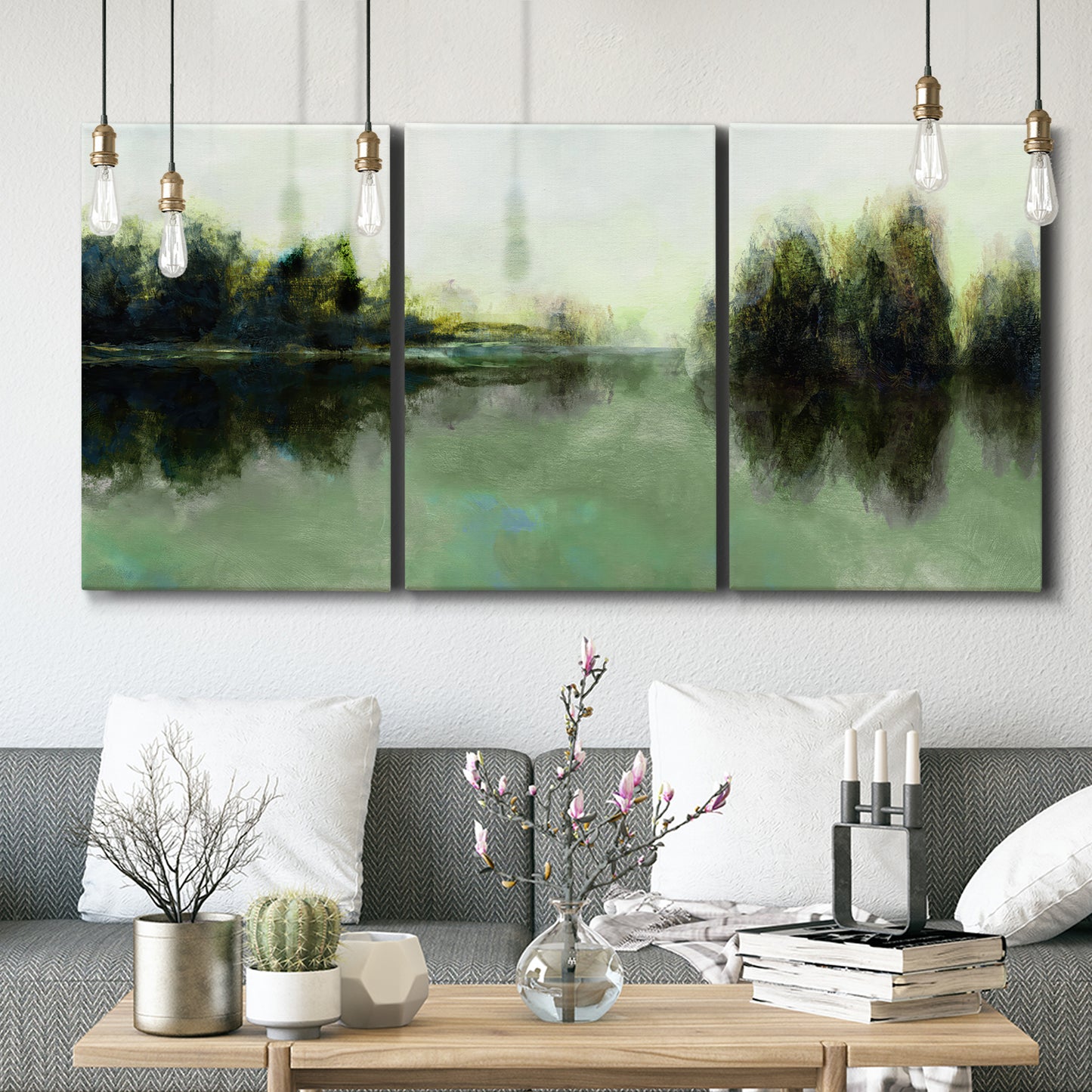 Three-panel canvas wall art featuring rain soaked landscape at sunset, displayed in a modern living room above seating.