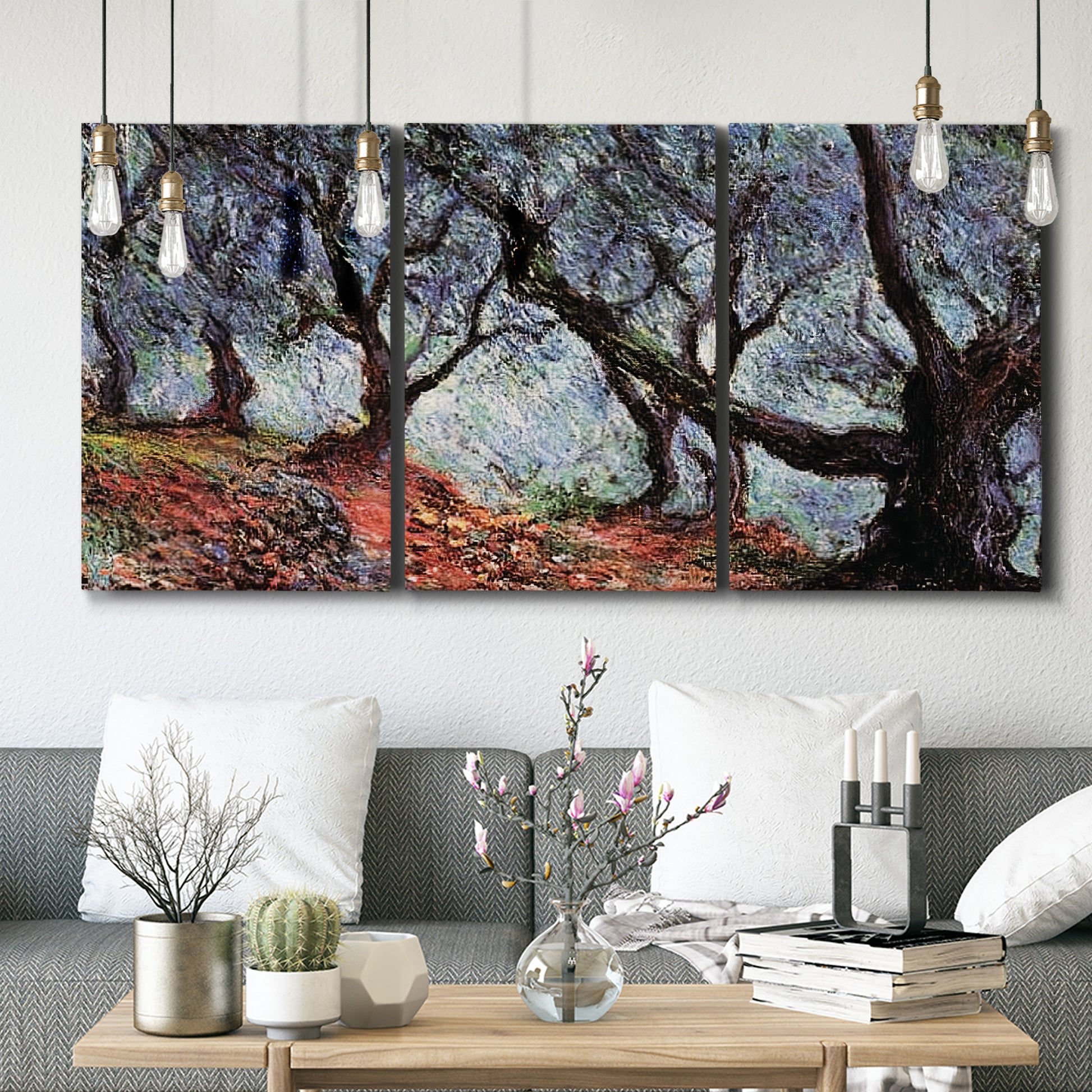 Three-panel canvas wall art featuring pine trees silhouetted at evening, displayed in a modern living room above seating.