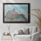 Impressionist coastal building landscape by Claude Monet in an ornate black frame with gilded inner detail displayed in a bright interior setting.