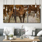 Three-panel canvas wall art featuring longhorn cattle standing together, displayed in a modern living room above seating.