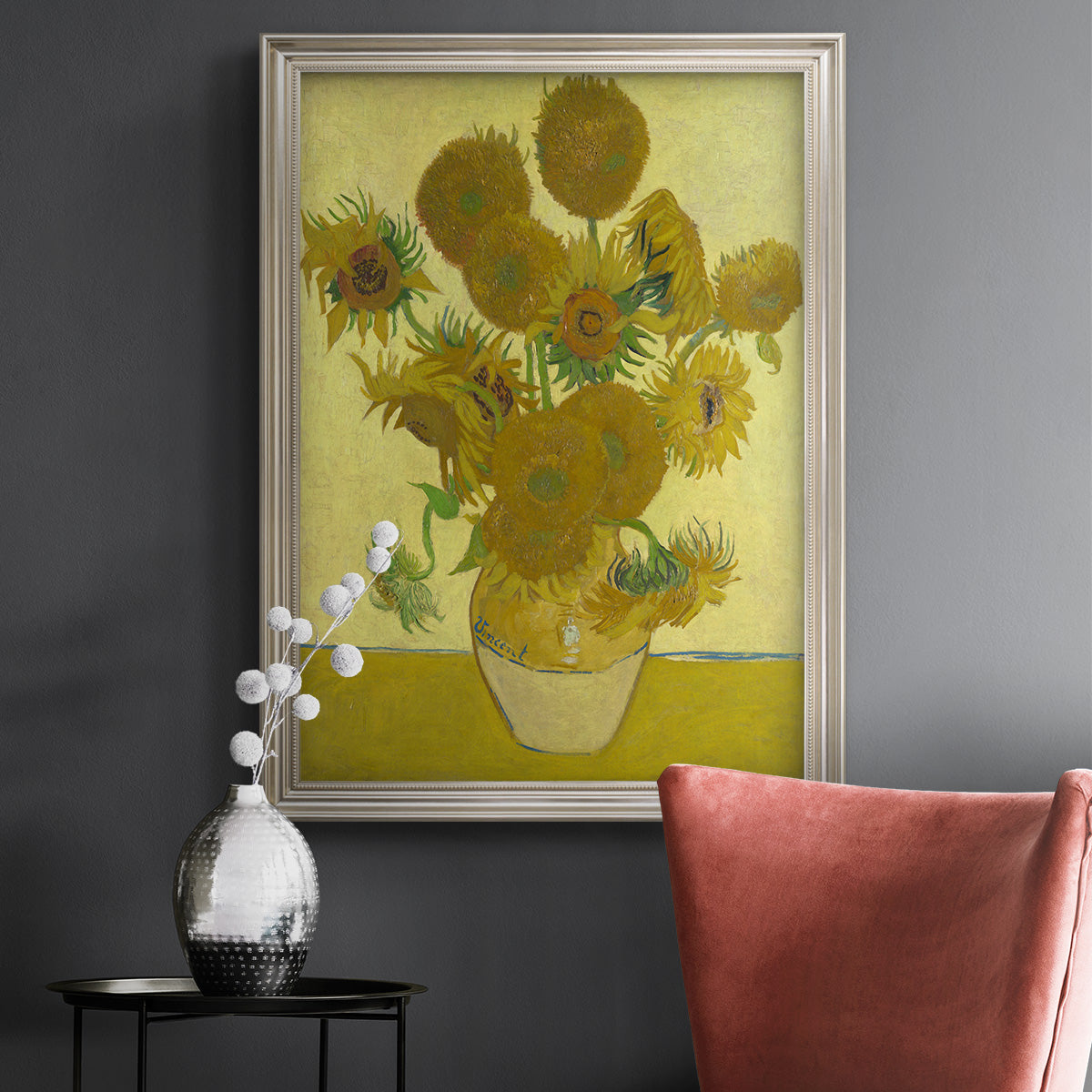 Impressionist sunflower still life painting by Vincent van Gogh in an ornate champagne frame displayed in a dark-toned interior setting.