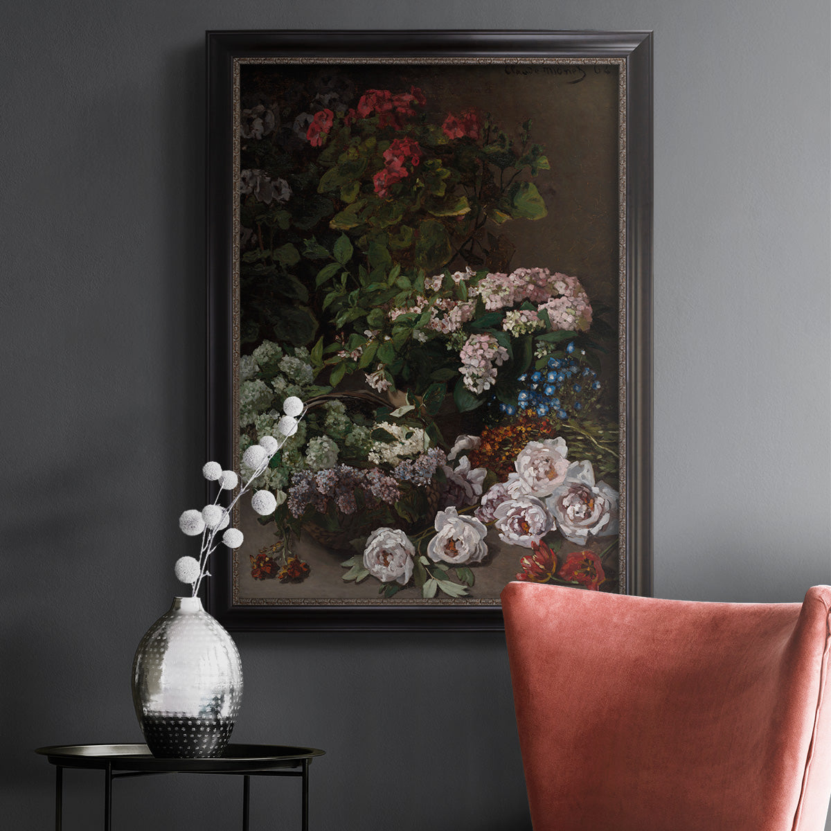 Early impressionist floral painting by Claude Monet in an ornate black frame with gilded inner detail displayed in a dark-toned interior setting.