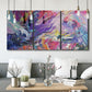 Three-panel canvas wall art featuring expressive abstract with layered color, displayed in a modern living room above seating.