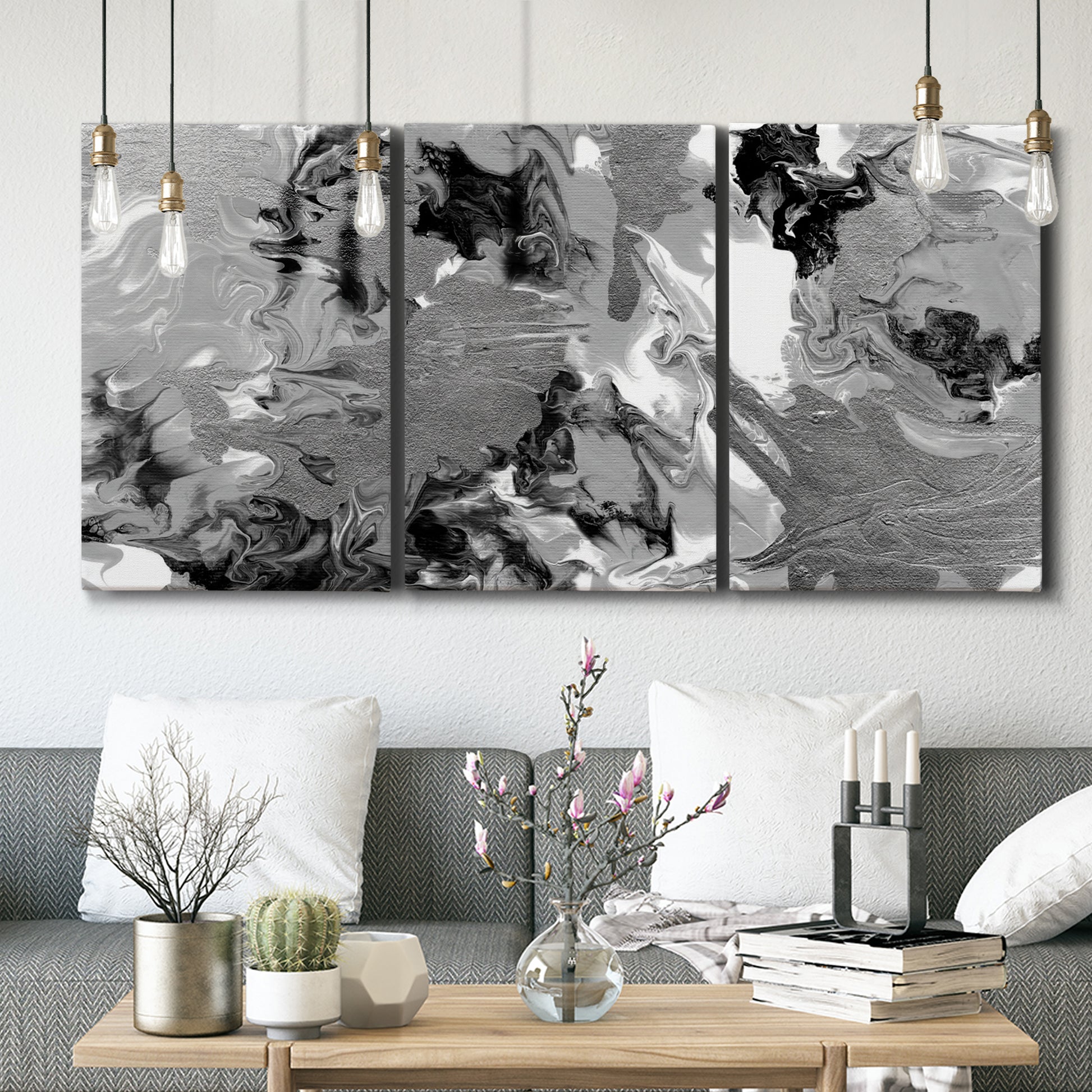 Three-panel canvas wall art featuring abstract marble texture composition, displayed in a modern living room above seating.