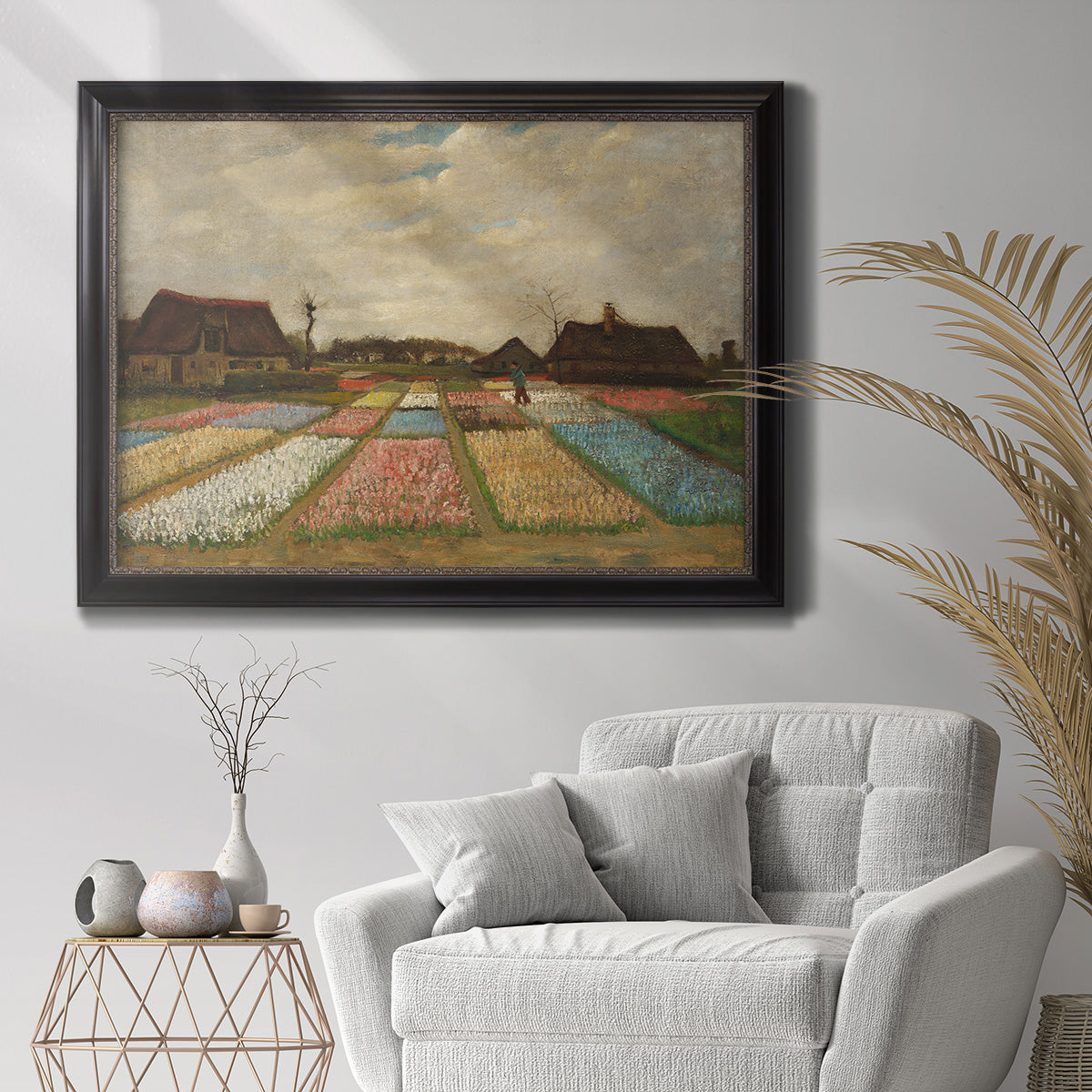 Impressionist Dutch bulb field landscape by Vincent van Gogh in an ornate black frame with gilded inner detail displayed in a bright interior setting.