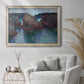 Impressionist rocky seascape by Claude Monet in an ornate champagne frame displayed in a bright interior setting.