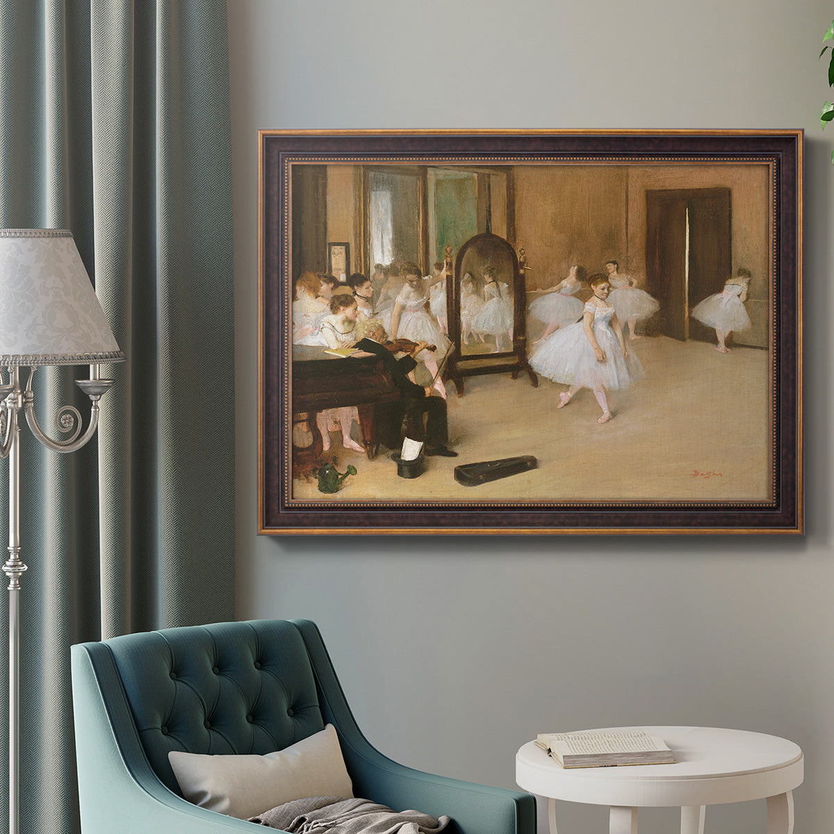 Impressionist dance class interior scene by Edgar Degas in an ornate bronzed mahogany wood frame displayed in a bright interior setting.