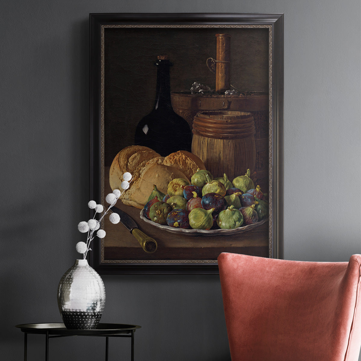 Realist still life with figs and bread by Luis Meléndez in an ornate black frame with gilded inner detail displayed in a dark-toned interior setting.