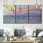 Three-panel canvas wall art featuring sunset reflections across calm sea, displayed in a modern living room above seating.