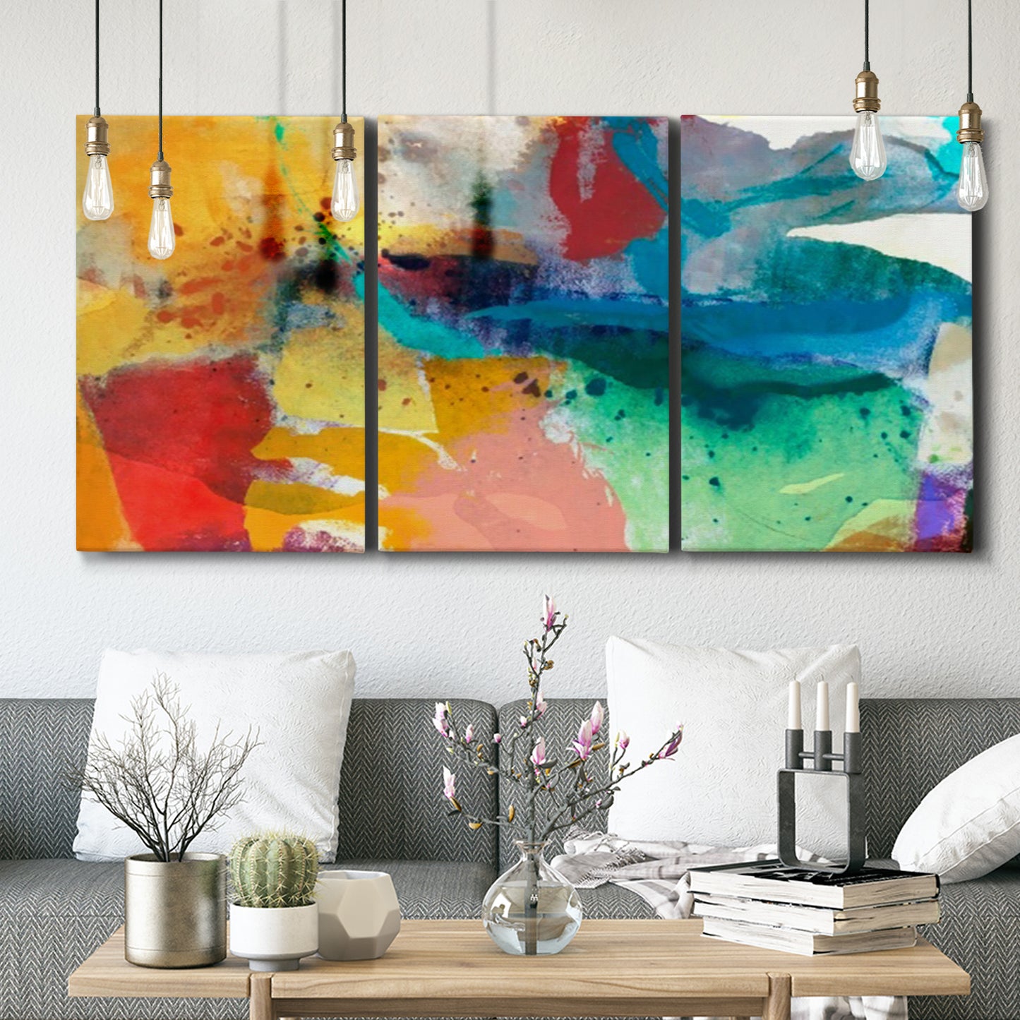 Three-panel canvas wall art featuring layered abstract observational color blocks, displayed in a modern living room above seating.