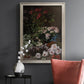 Early impressionist floral painting by Claude Monet in an ornate champagne frame displayed in a dark-toned interior setting.