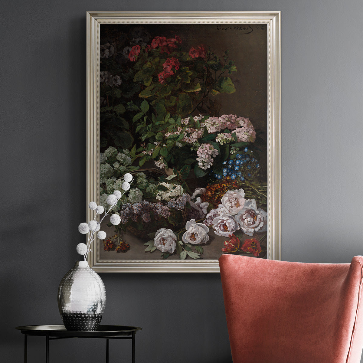 Early impressionist floral painting by Claude Monet in an ornate champagne frame displayed in a dark-toned interior setting.