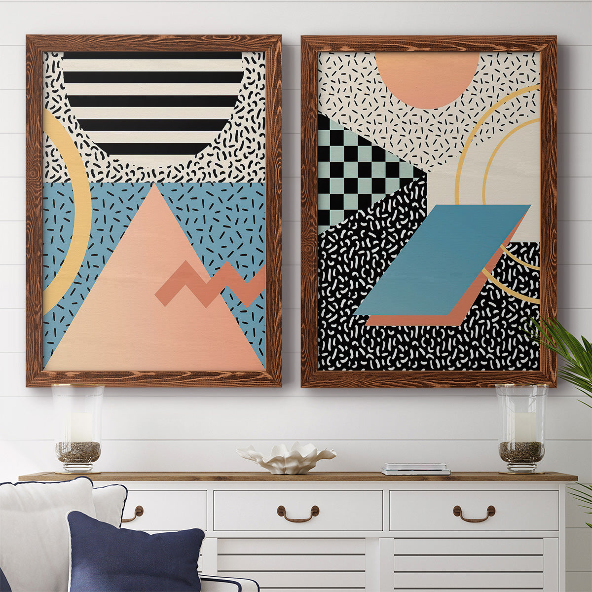 Set of two maple barnwood framed canvas prints depicting a coordinated art pair of bold geometric Memphis-style patterns rendered as retro graphic abstracts above a dining room sideboard.