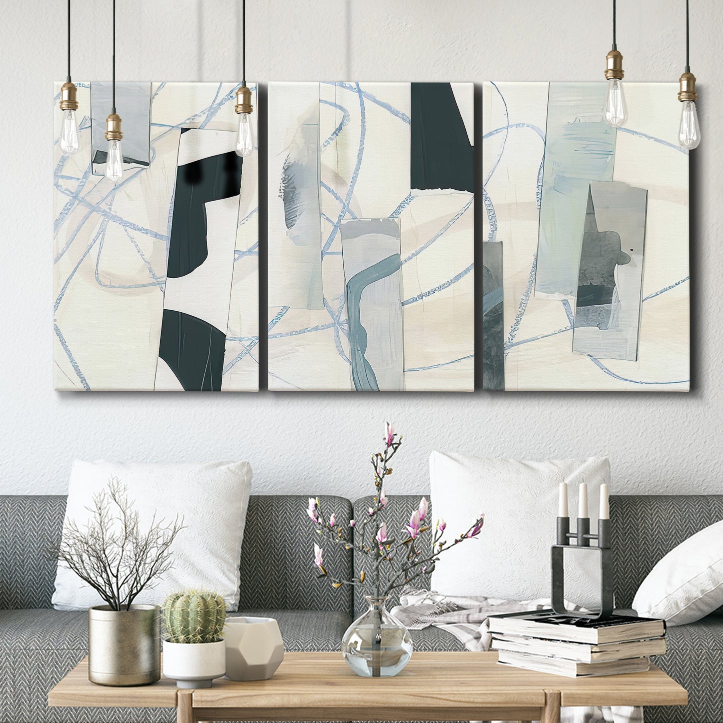 Three-panel canvas wall art featuring interwoven icy abstract linear forms, displayed in a modern living room above seating.