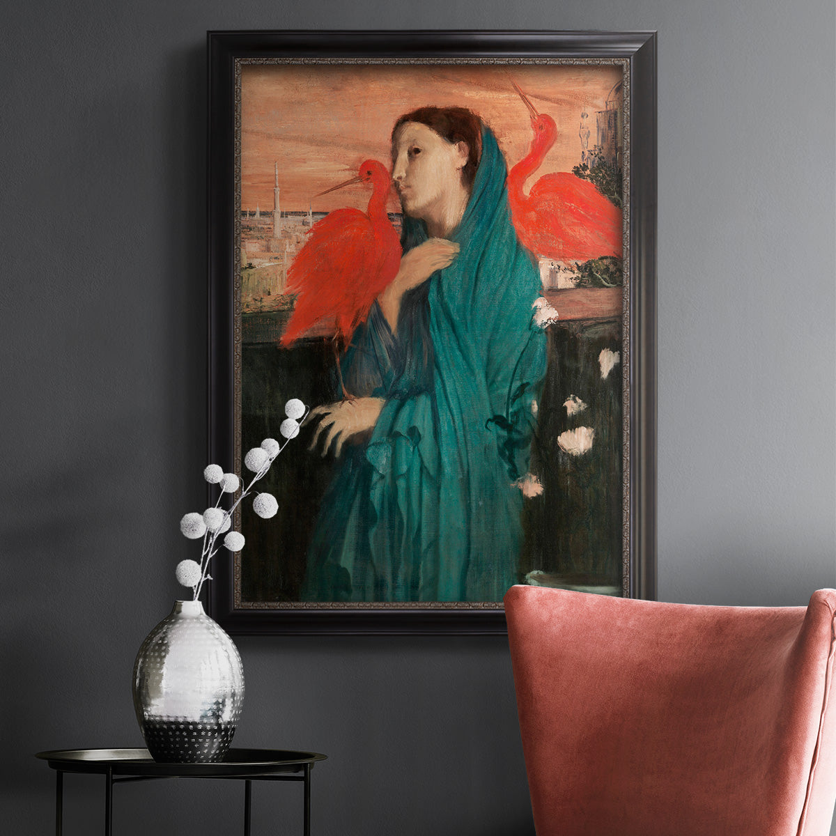 Impressionist portrait of a young woman with an ibis by Edgar Degas in an ornate black frame with gilded inner detail displayed in a dark-toned interior setting.