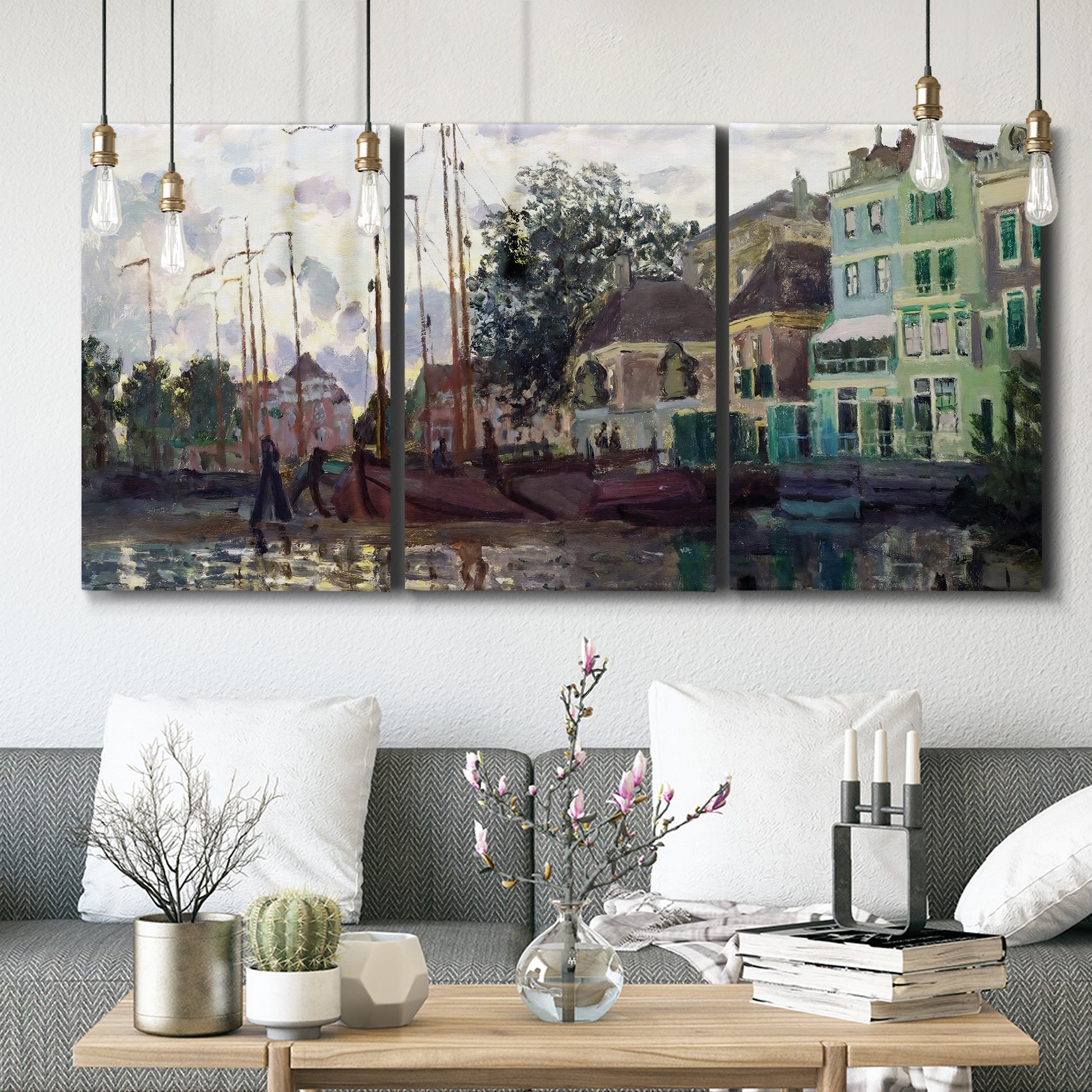Three-panel canvas wall art featuring riverside town dike at evening, displayed in a modern living room above seating.