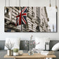 Three-panel canvas wall art featuring london street scene photograph, displayed in a modern living room above seating.