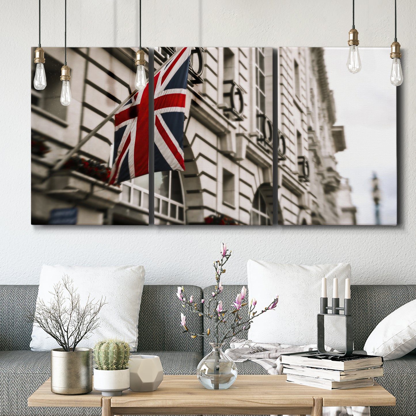 Three-panel canvas wall art featuring london street scene photograph, displayed in a modern living room above seating.