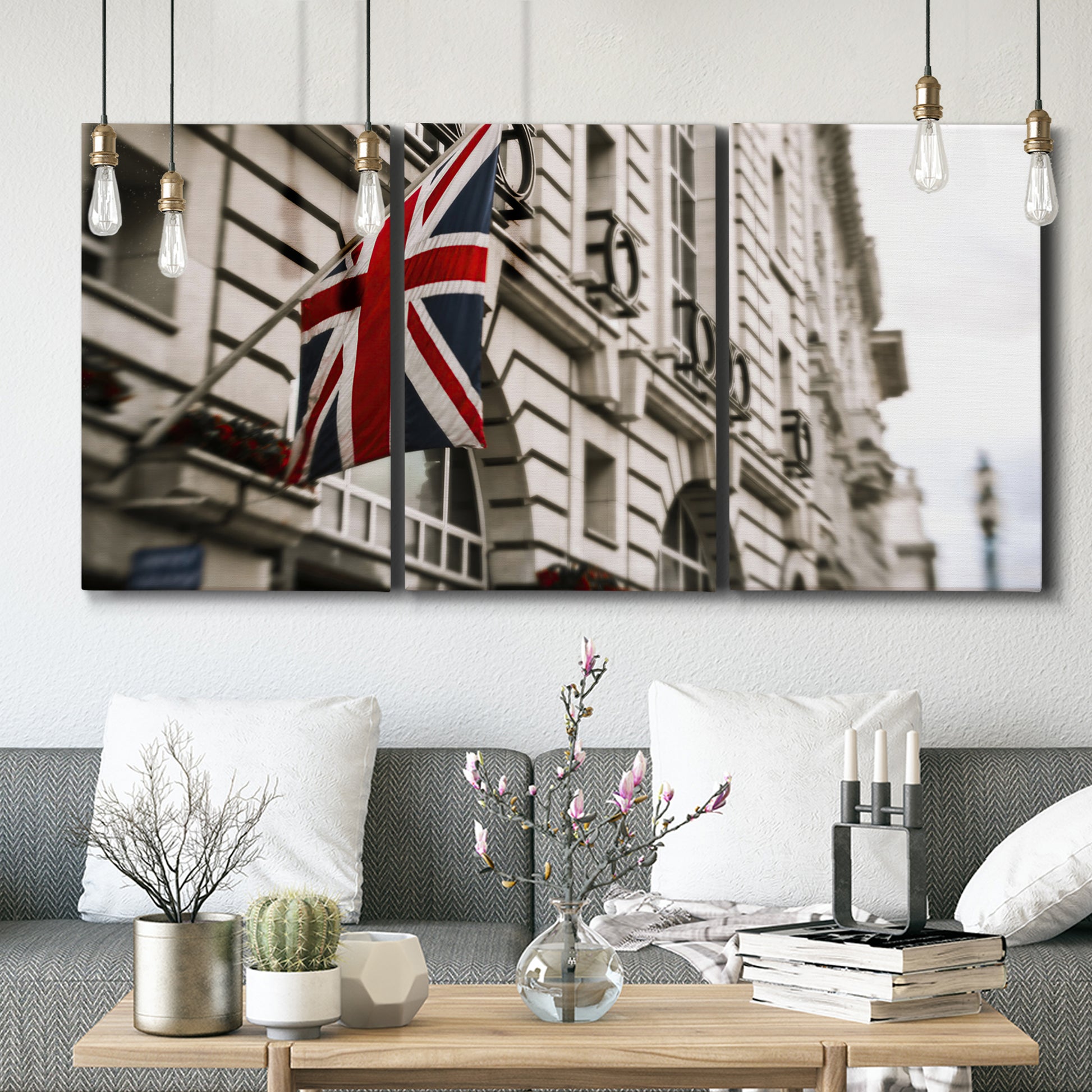 Three-panel canvas wall art featuring london street scene photograph, displayed in a modern living room above seating.