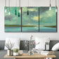 Three-panel canvas wall art featuring still lagoon water beneath open sky, displayed in a modern living room above seating.