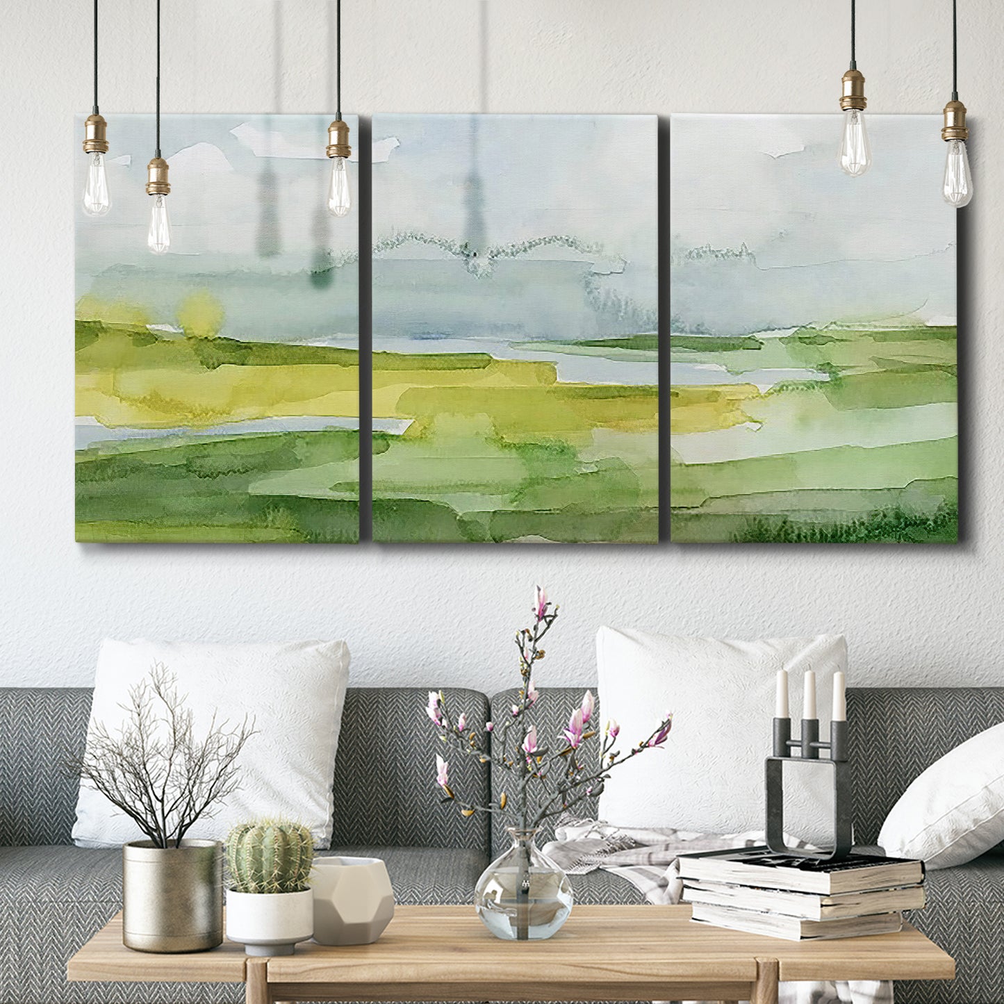 Three-panel canvas wall art featuring lowland wetlands with reflective water, displayed in a modern living room above seating.