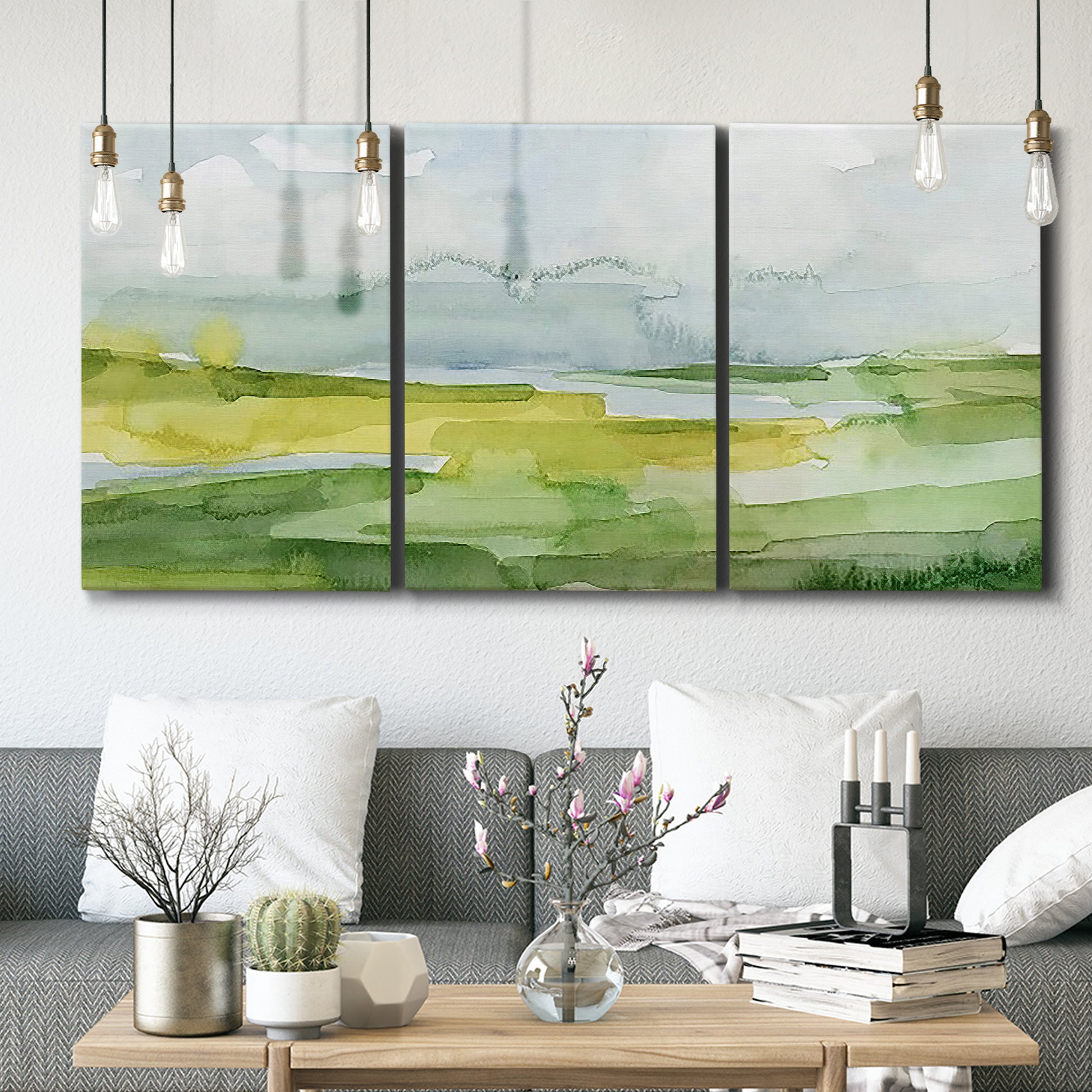 Three-panel canvas wall art featuring lowland wetlands with reflective water, displayed in a modern living room above seating.