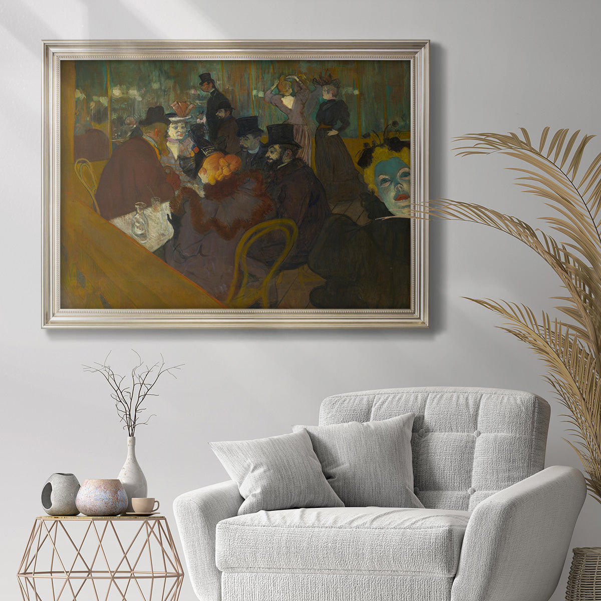 Impressionist cabaret interior scene by Henri de Toulouse-Lautrec in an ornate champagne frame displayed in a dark-toned interior setting.