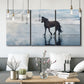 Three-panel canvas wall art featuring running horses captured mid stride, displayed in a modern living room above seating.