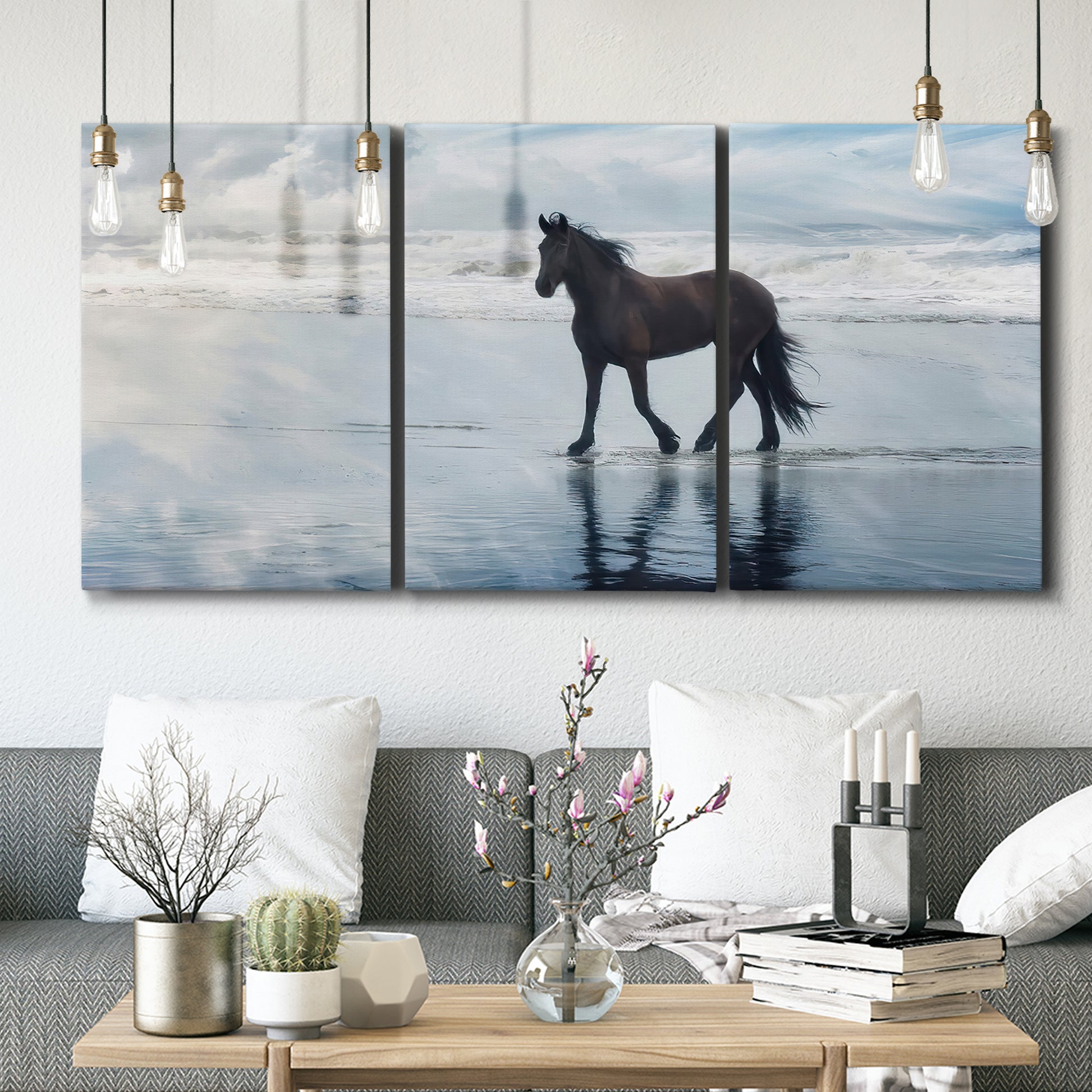 Three-panel canvas wall art featuring running horses captured mid stride, displayed in a modern living room above seating.