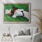 Impressionist outdoor portrait of two girls by John Singer Sargent in an ornate champagne frame displayed in a bright interior setting.