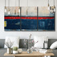 Three-panel canvas wall art featuring weathered coastal dock scene, displayed in a modern living room above seating.