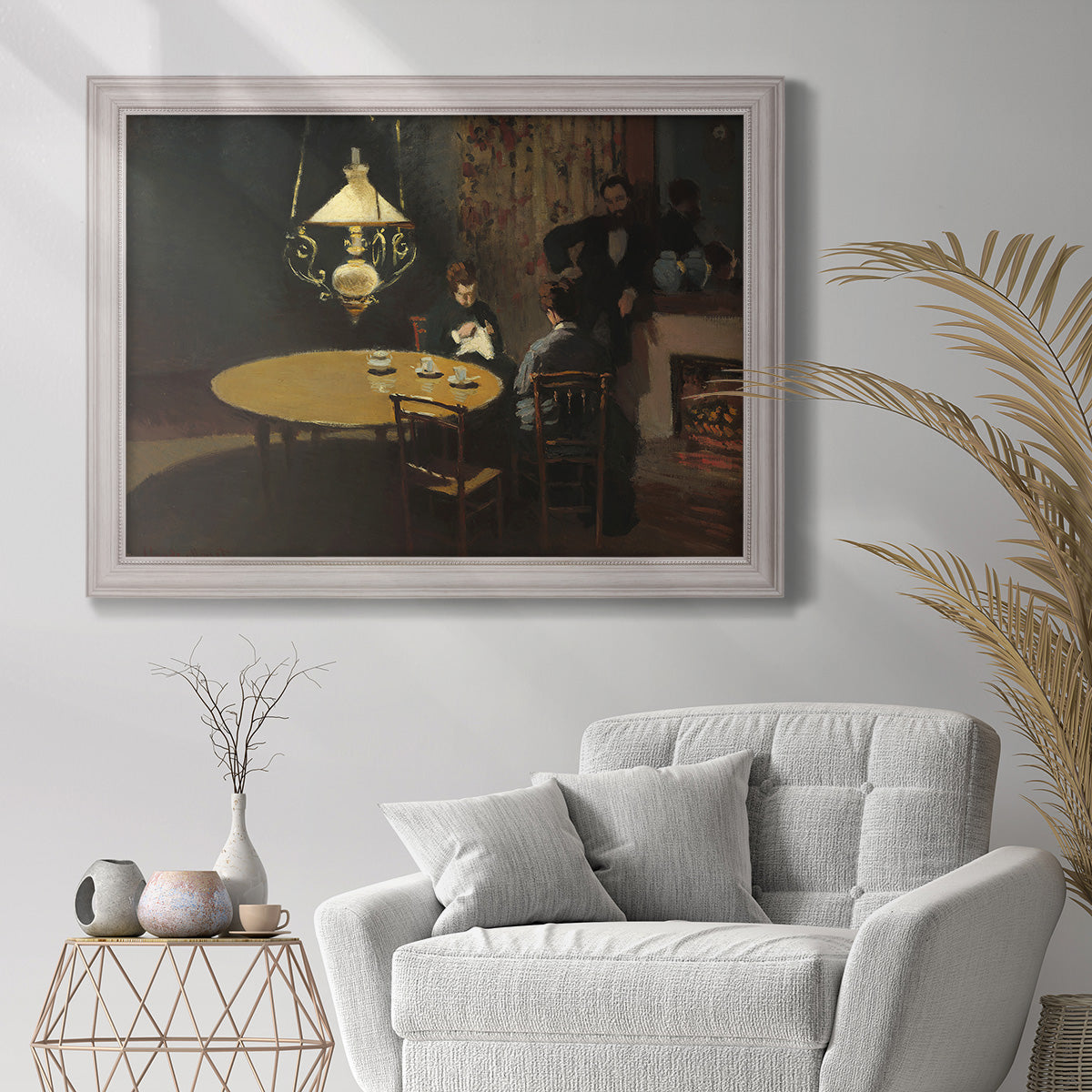 Impressionist domestic interior scene by Claude Monet in an ornate weathered white frame displayed in a bright interior setting.