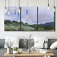 Three-panel canvas wall art featuring wide open pastoral horizon landscape, displayed in a modern living room above seating.