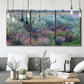 Three-panel canvas wall art featuring flowered riverbank with trees, displayed in a modern living room above seating.