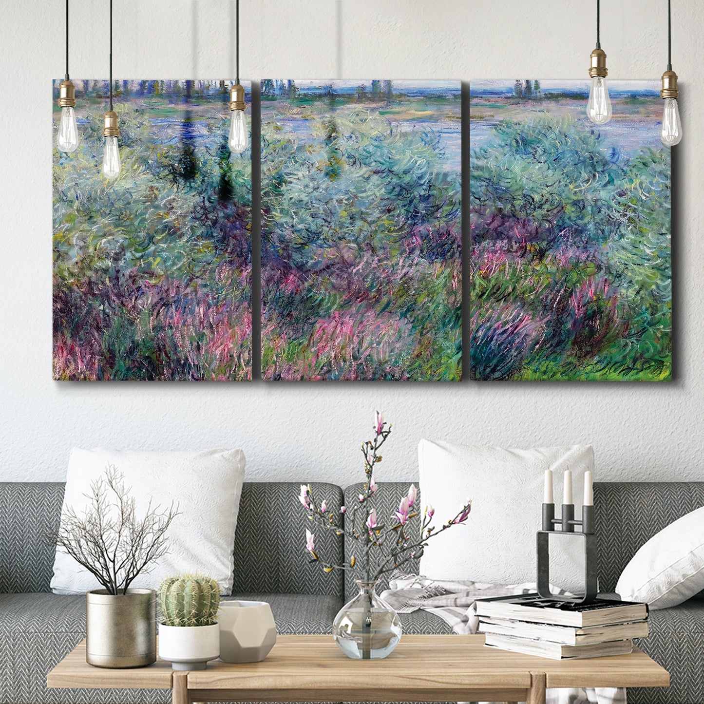 Three-panel canvas wall art featuring flowered riverbank with trees, displayed in a modern living room above seating.