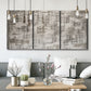Three-panel canvas wall art featuring grid based geometric abstraction, displayed in a modern living room above seating.