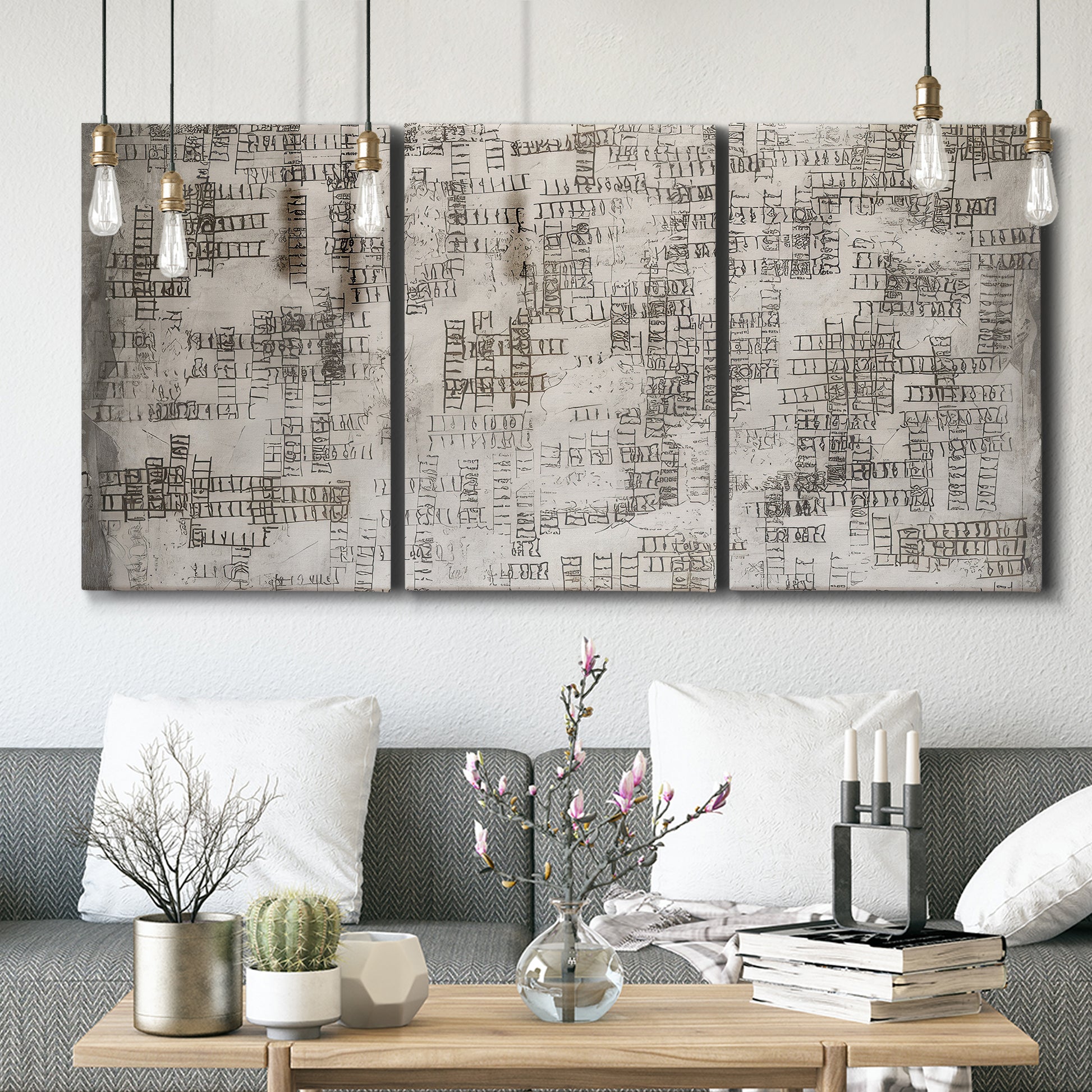 Three-panel canvas wall art featuring grid based geometric abstraction, displayed in a modern living room above seating.